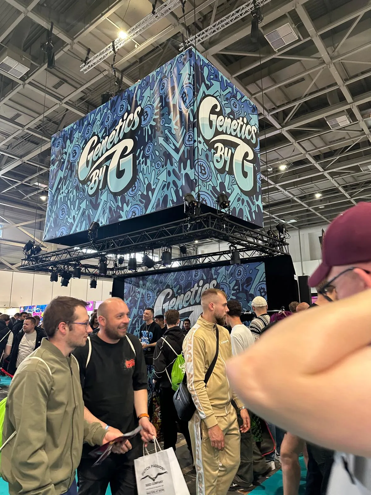 Genetics by G booth with a large LED cube display and crowds at Mary Jane Berlin 2026